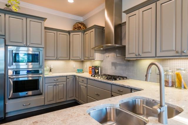 16 Clipper Street Inlet Beach, FL 32461 - Photo 24 of 34 a kitchen with stainless steel appliances granite countertop a sink and cabinets
