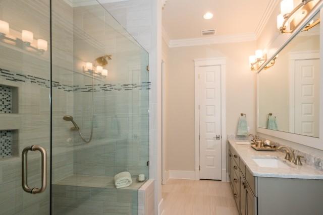 16 Clipper Street Inlet Beach, FL 32461 - Photo 30 of 34 a bathroom with a granite countertop sink a shower and mirror