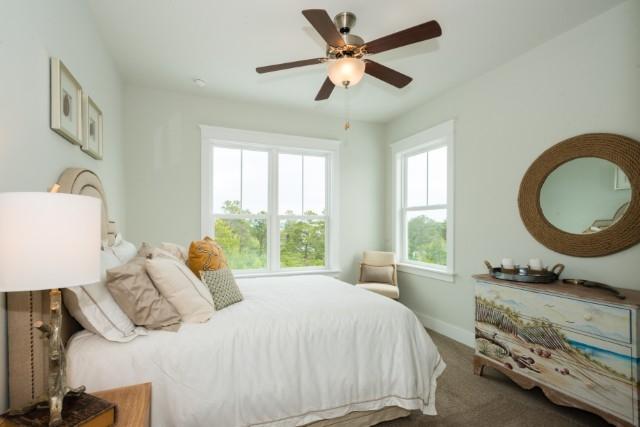 16 Clipper Street Inlet Beach, FL 32461 - Photo 5 of 34 a bedroom with a bed a dresser and a window