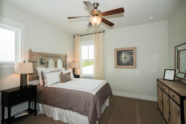 16 Clipper Street Inlet Beach, FL 32461 - Photo 7 of 34 a bedroom with a bed and a chandelier