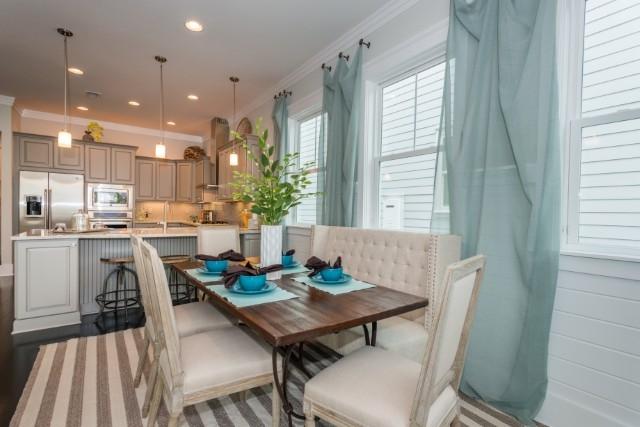 16 Clipper Street Inlet Beach, FL 32461 - Photo 8 of 34 a view of a dining room with furniture and wooden floor