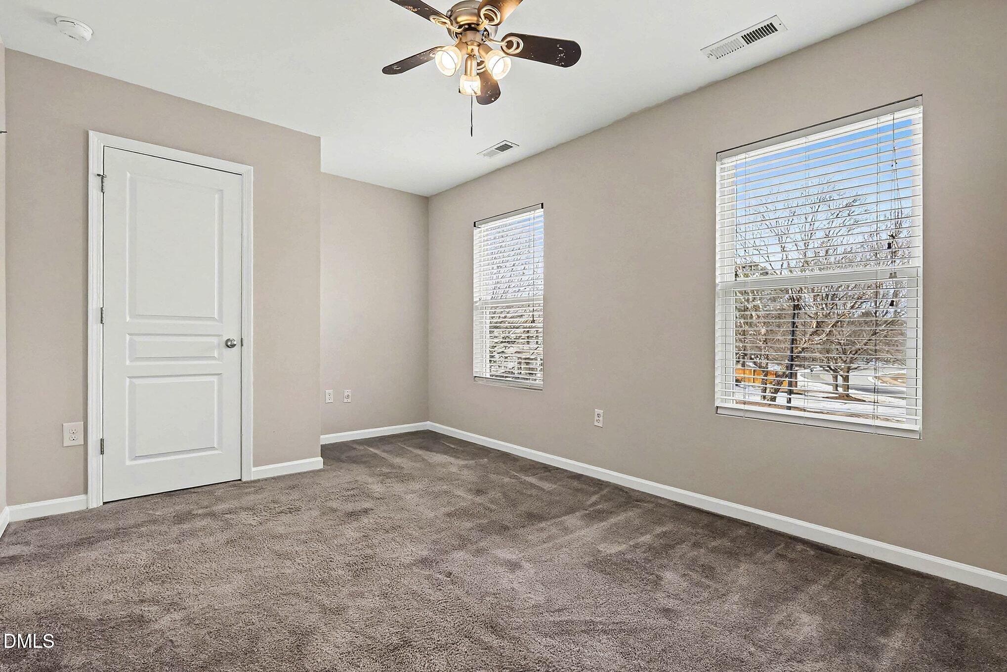 2905 Berkeley Springs Place Raleigh, NC 27616 - Photo 12 of 20 a view of an empty room with a window