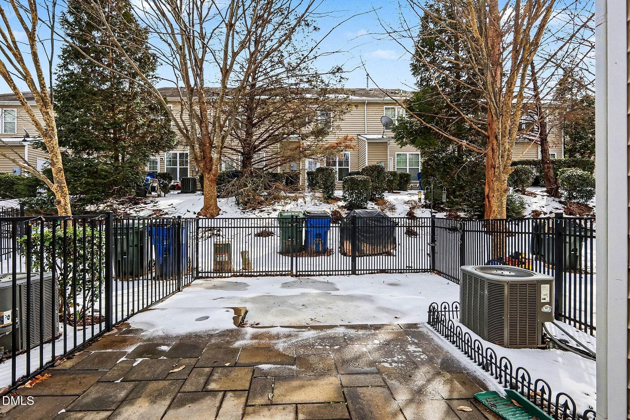 2905 Berkeley Springs Place Raleigh, NC 27616 - Photo 17 of 20 a view of a patio with iron fence