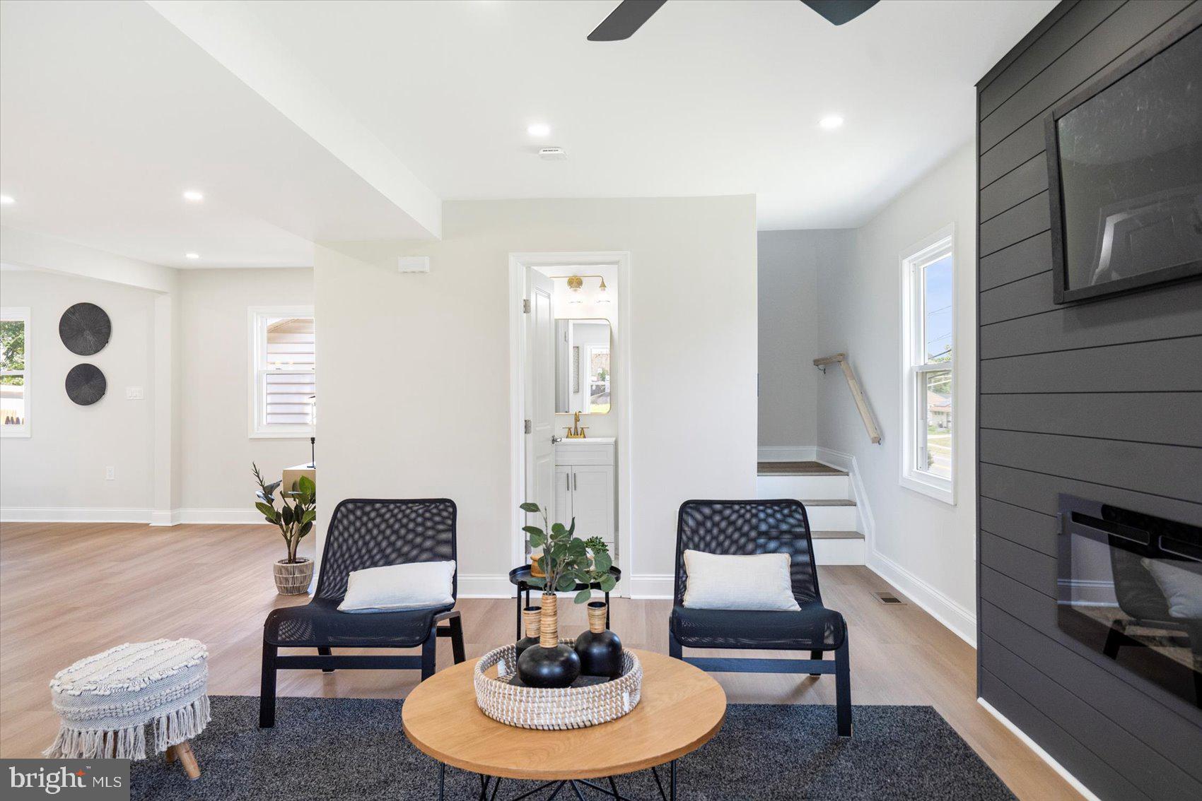 4810 Whitfield Chapel Road Lanham, MD 20706 - Photo 12 of 52 a living room with furniture and a potted plant