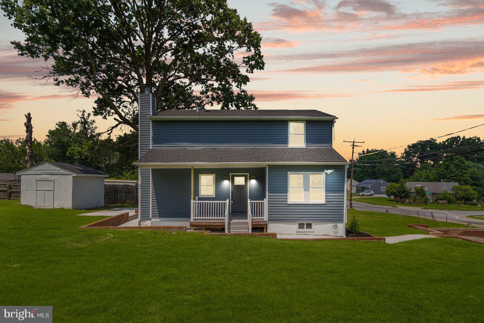 4810 Whitfield Chapel Road Lanham, MD 20706 - Photo 2 of 52 a front view of a house with a garden