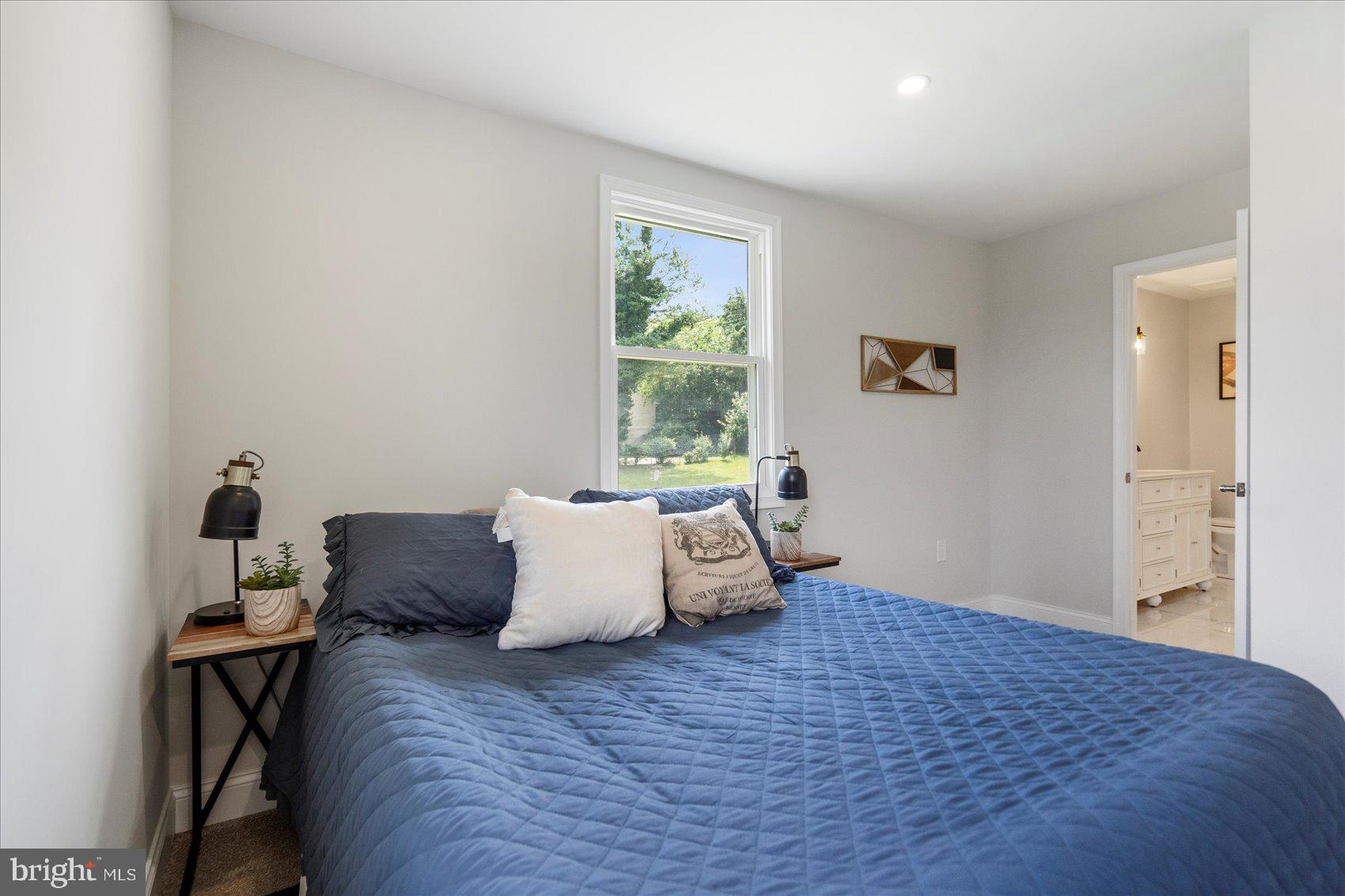 4810 Whitfield Chapel Road Lanham, MD 20706 - Photo 22 of 52 a bedroom with a bed and wooden floor