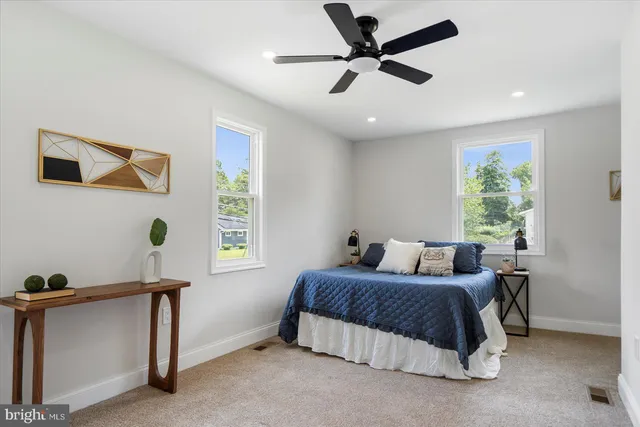 a bedroom with bed and a window