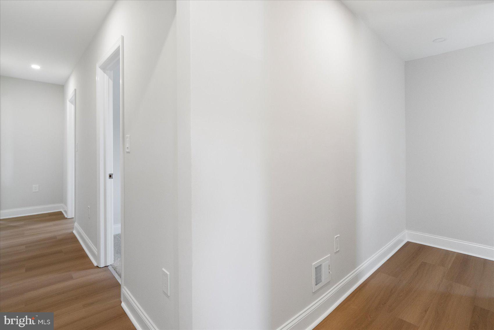 4810 Whitfield Chapel Road Lanham, MD 20706 - Photo 28 of 52 a view of a hallway with wooden floor