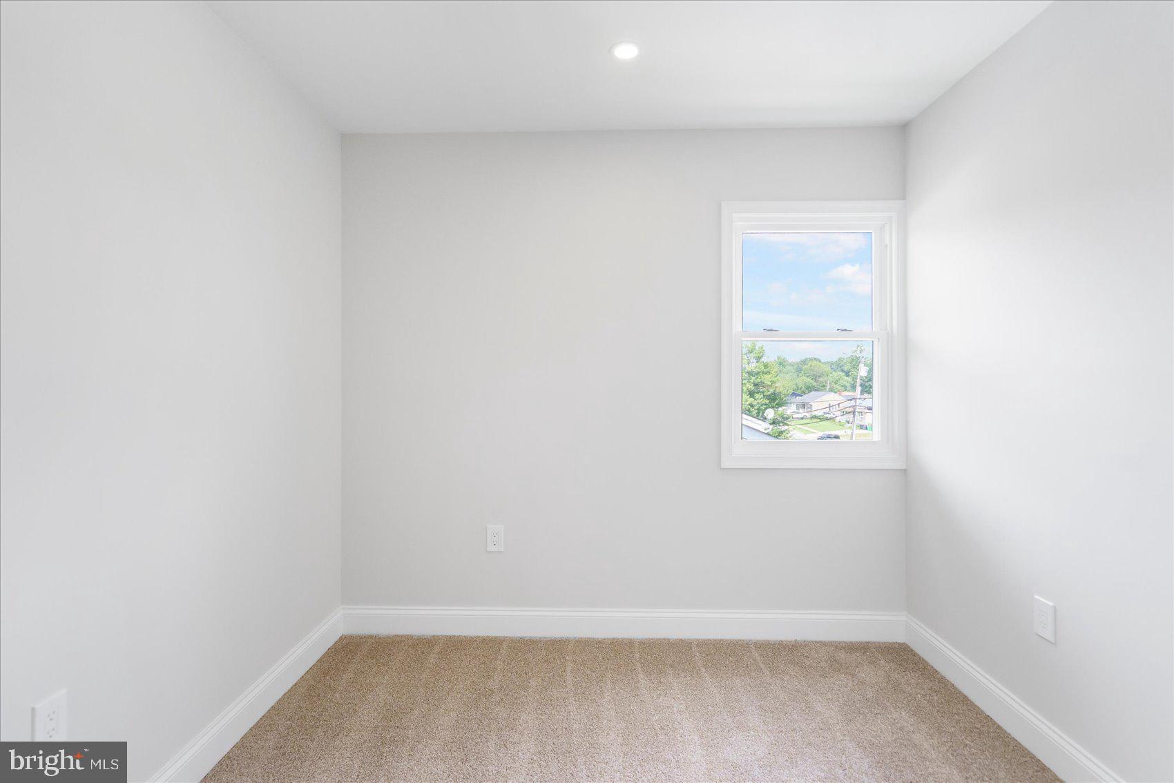 4810 Whitfield Chapel Road Lanham, MD 20706 - Photo 29 of 52 an empty room with a window