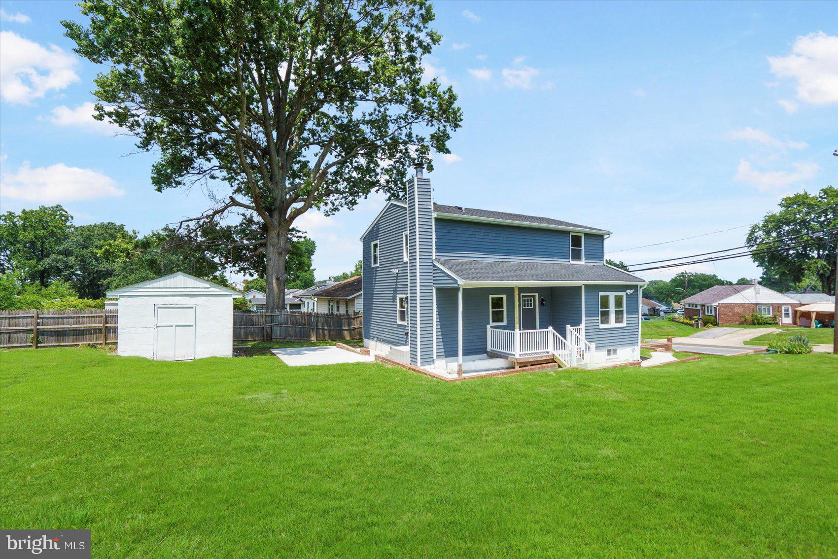 4810 Whitfield Chapel Road Lanham, MD 20706 - Photo 3 of 52 a front view of a house with a yard and trees
