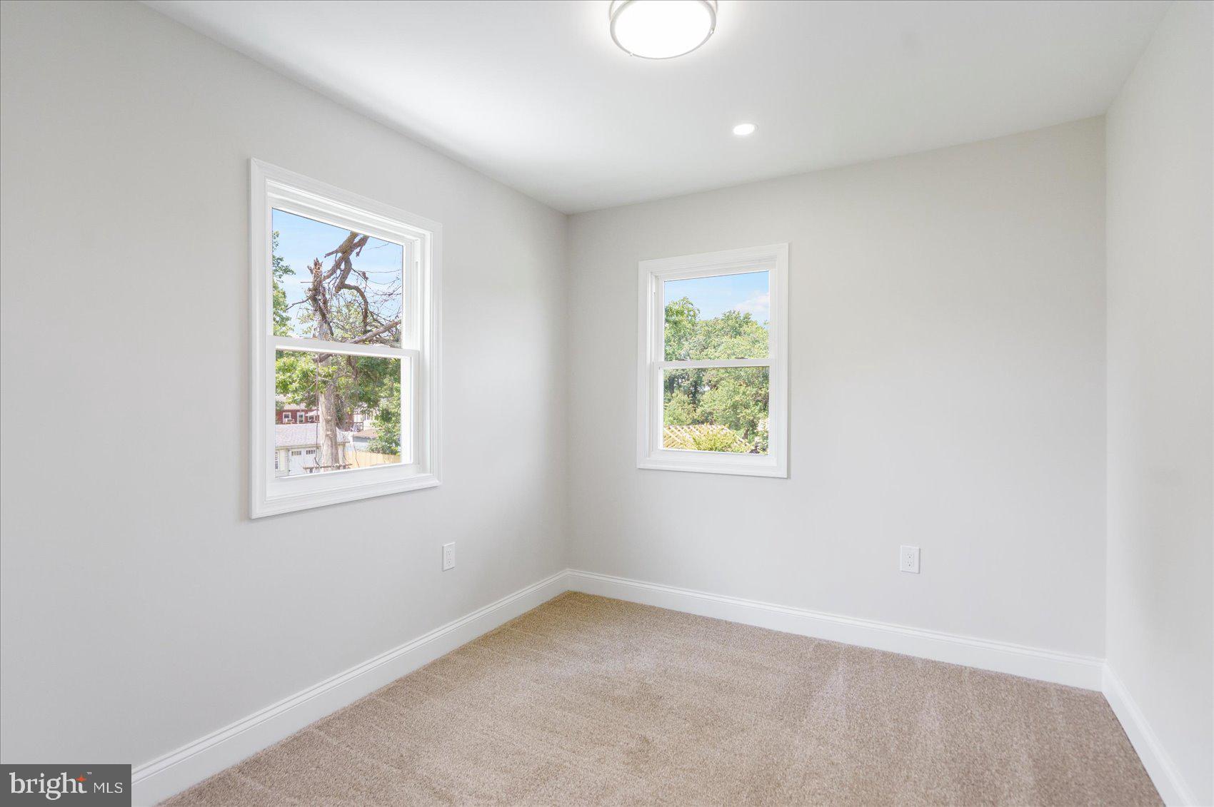 4810 Whitfield Chapel Road Lanham, MD 20706 - Photo 31 of 52 an empty room with a window
