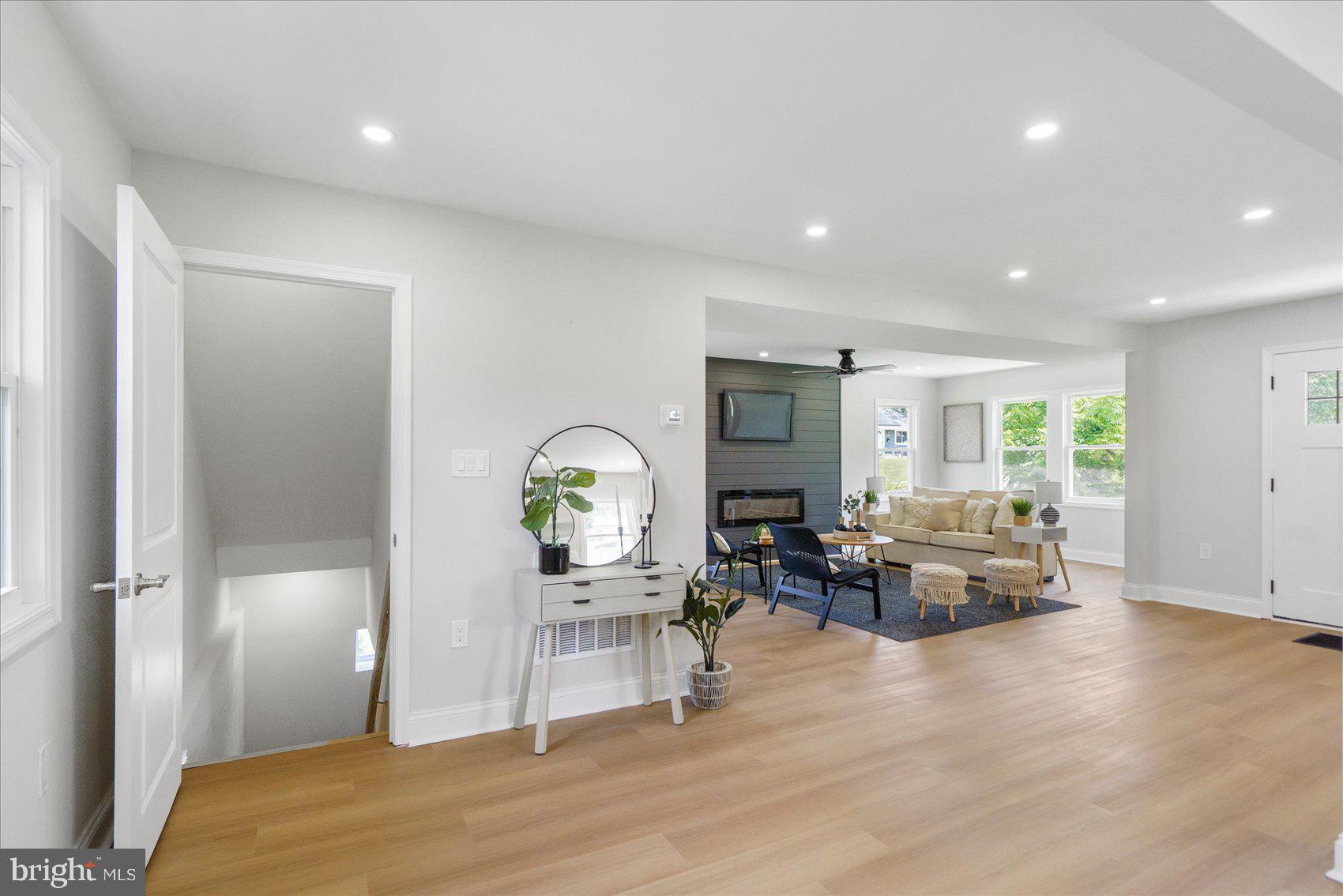 4810 Whitfield Chapel Road Lanham, MD 20706 - Photo 36 of 52 a living room with furniture and a wooden floor