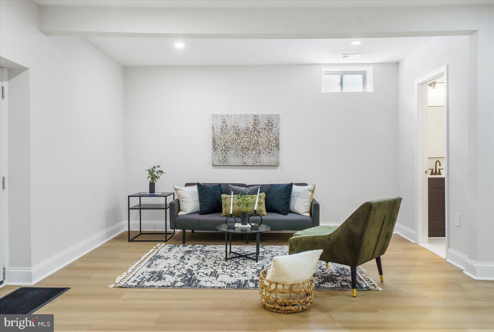 4810 Whitfield Chapel Road Lanham, MD 20706 - Photo 38 of 52 a living room with furniture and wooden floor