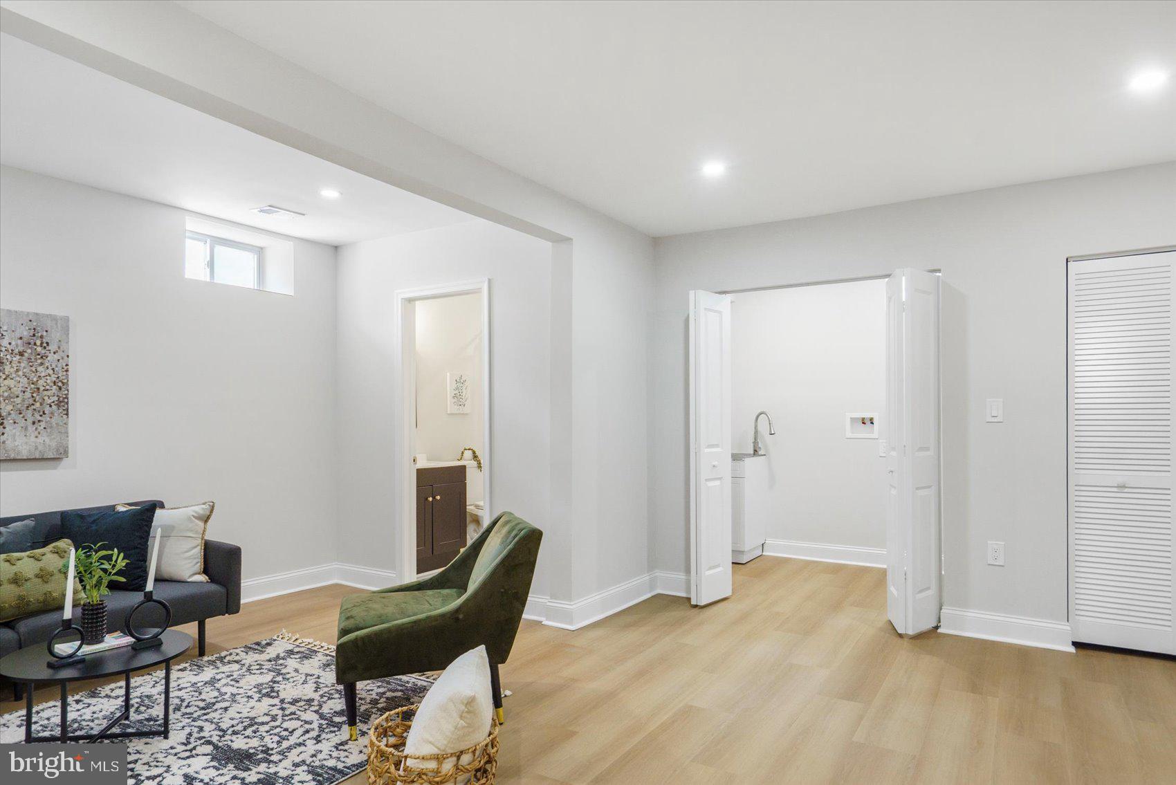 4810 Whitfield Chapel Road Lanham, MD 20706 - Photo 39 of 52 a view of a livingroom with furniture and wooden floor