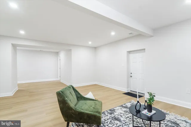 a living room with furniture and a pool