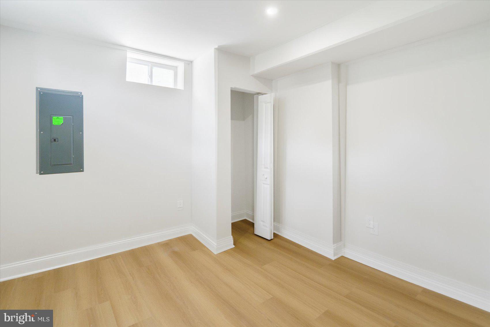 4810 Whitfield Chapel Road Lanham, MD 20706 - Photo 44 of 52 a view of an empty room with wooden floor