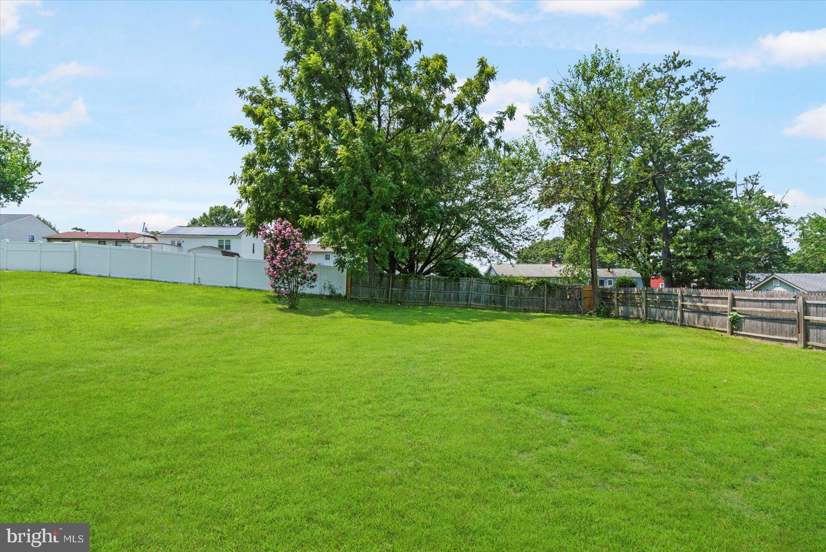 4810 Whitfield Chapel Road Lanham, MD 20706 - Photo 46 of 52 a view of a field of grass and trees