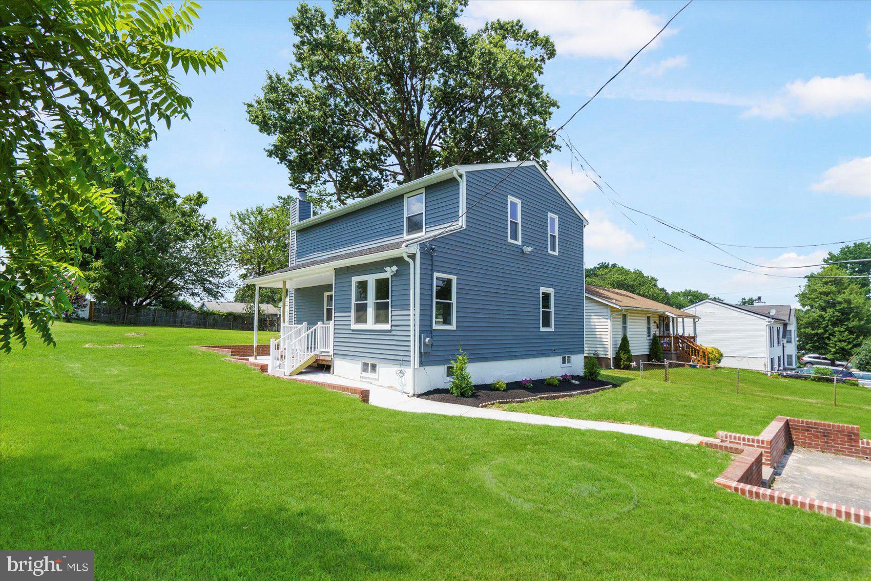 4810 Whitfield Chapel Road Lanham, MD 20706 - Photo 5 of 52 a front view of house with yard and green space