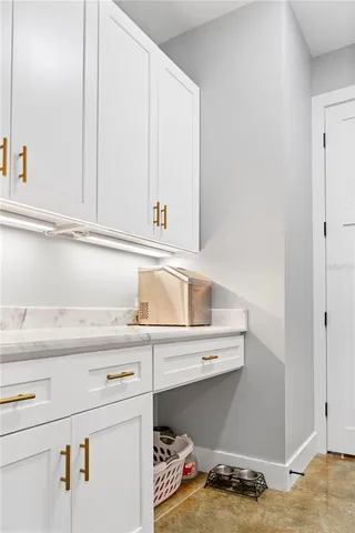 a kitchen with a sink and cabinets