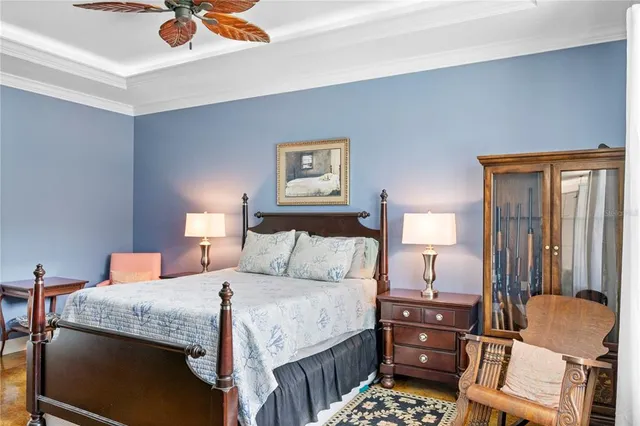 a bedroom with a bed and chair