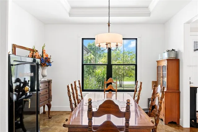 a view of a dining room with furniture window and outside view