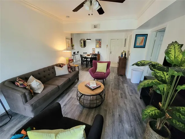 a living room with furniture and a rug