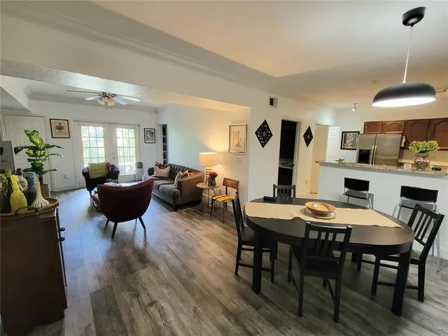 a view of a dining room with furniture and wooden floor