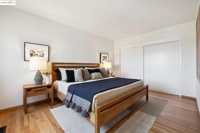 a bed room with a bed and a night stand