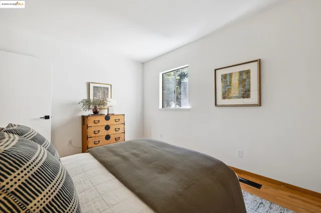 a bedroom with a bed and dresser