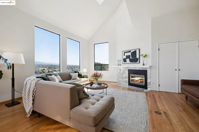a living room with furniture fireplace and a flat screen tv