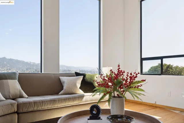 a vase of flowers sitting on a table with a couch