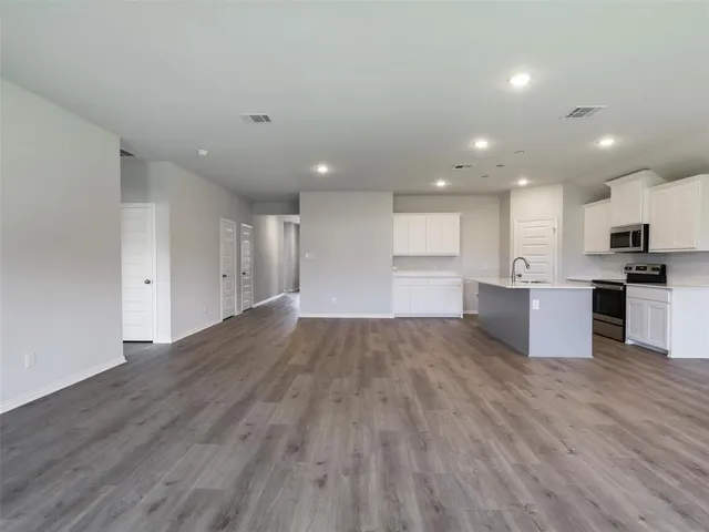 a view of kitchen with wooden floor