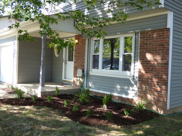 348 East Briarcliff Road Bolingbrook, IL 60440 - Photo 2 of 20 a front view of a house with a yard