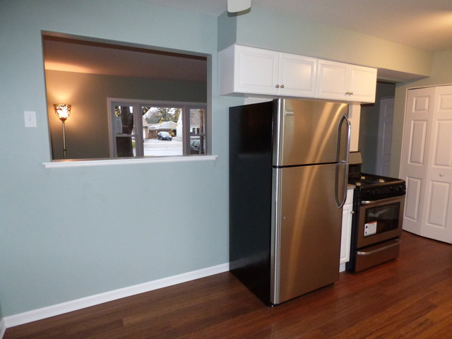 348 East Briarcliff Road Bolingbrook, IL 60440 - Photo 11 of 20 a view of a kitchen with wooden floor and a refrigerator