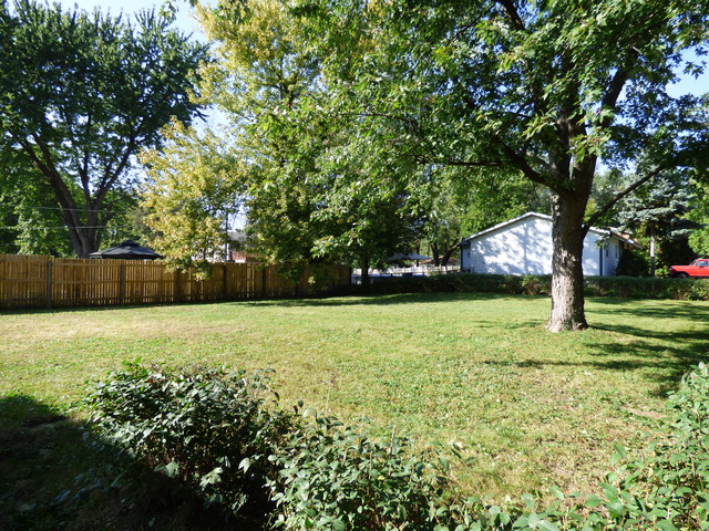 348 East Briarcliff Road Bolingbrook, IL 60440 - Photo 4 of 20 a view of outdoor space with deck and trees