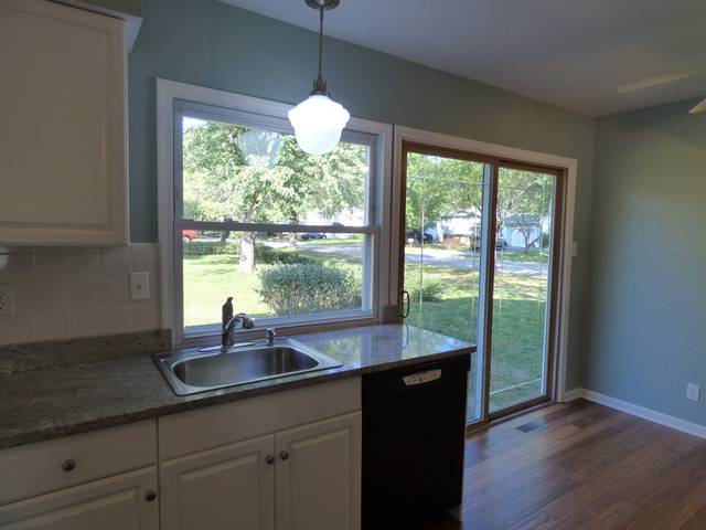 348 East Briarcliff Road Bolingbrook, IL 60440 - Photo 10 of 20 a kitchen with a sink and large window