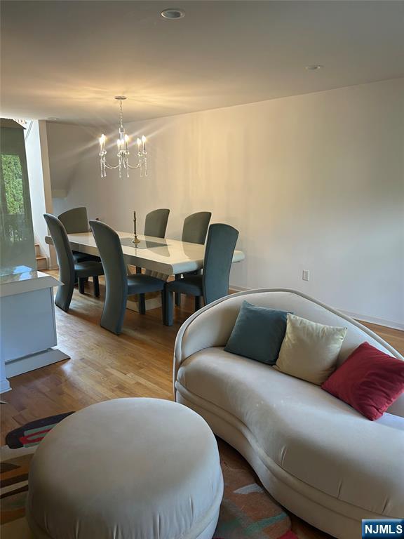 302 Grand Ridge Drive, Unit 302 Ridgefield, NJ 07657 - Photo 12 of 41 a living room with furniture and wooden floor