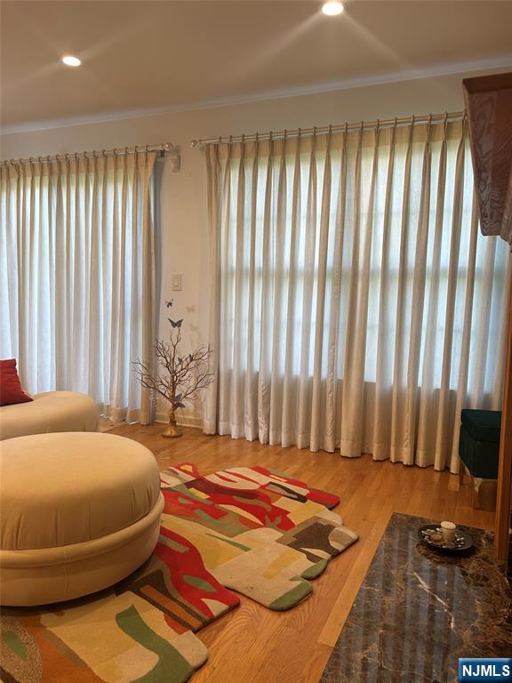 302 Grand Ridge Drive, Unit 302 Ridgefield, NJ 07657 - Photo 17 of 41 a bedroom with a bed and large windows