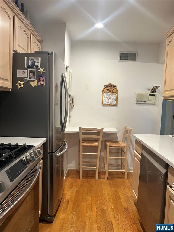 302 Grand Ridge Drive, Unit 302 Ridgefield, NJ 07657 - Photo 20 of 41 a room with wooden floor and furniture