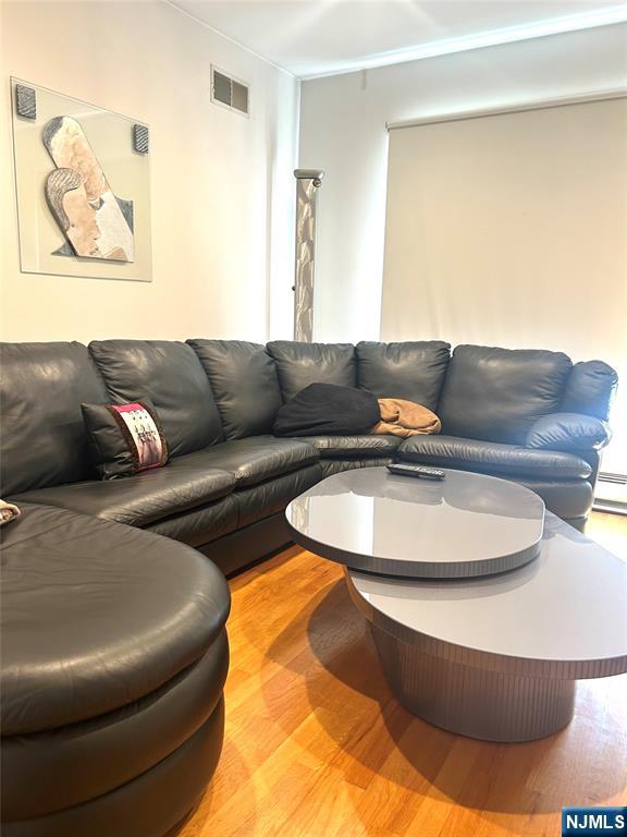 302 Grand Ridge Drive, Unit 302 Ridgefield, NJ 07657 - Photo 22 of 41 a living room with furniture and a couch