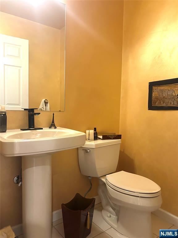 302 Grand Ridge Drive, Unit 302 Ridgefield, NJ 07657 - Photo 23 of 41 a bathroom with a sink and a toilet