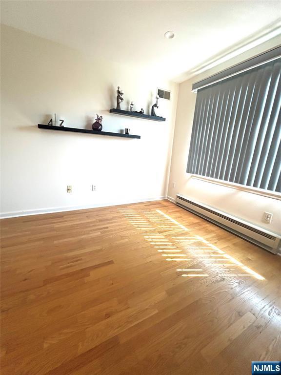 302 Grand Ridge Drive, Unit 302 Ridgefield, NJ 07657 - Photo 27 of 41 a view of a room with an empty space