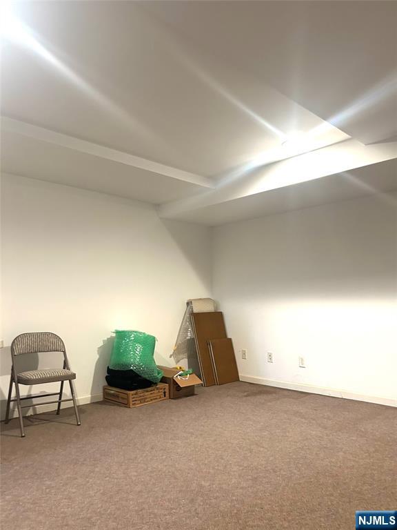 302 Grand Ridge Drive, Unit 302 Ridgefield, NJ 07657 - Photo 3 of 41 a room with a table and a couch