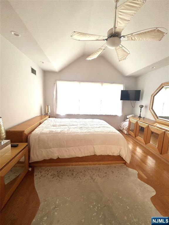 302 Grand Ridge Drive, Unit 302 Ridgefield, NJ 07657 - Photo 36 of 41 a large bed sitting in a room next to a window