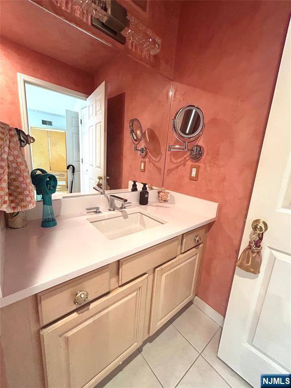 302 Grand Ridge Drive, Unit 302 Ridgefield, NJ 07657 - Photo 40 of 41 a bathroom with a sink and a mirror