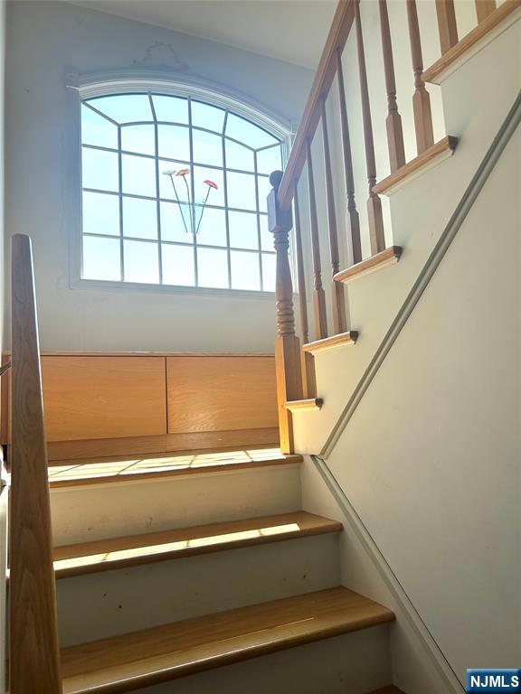 302 Grand Ridge Drive, Unit 302 Ridgefield, NJ 07657 - Photo 5 of 41 a view of staircase with large window