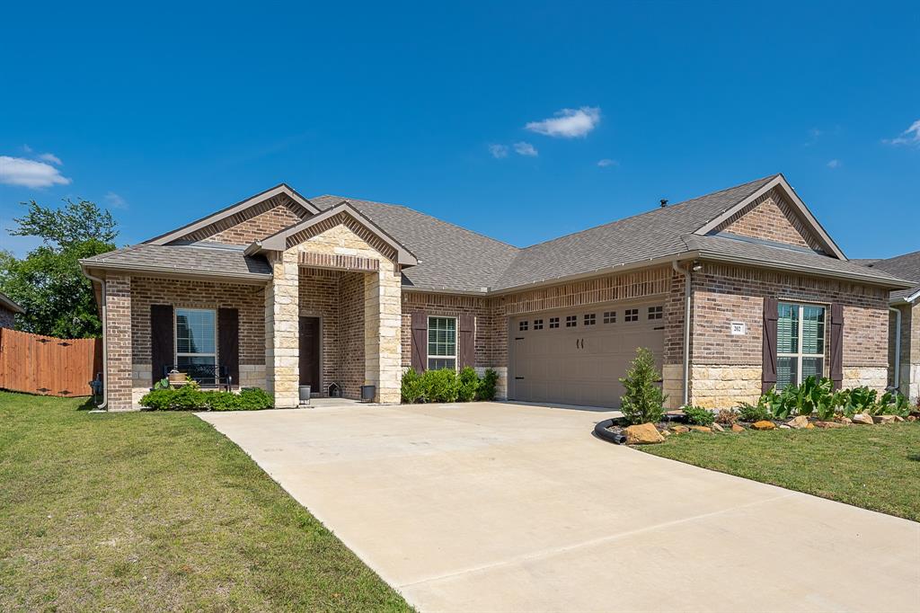 202 Ringold Road Red Oak, TX 75154 - Photo 1 of 1 a front view of a house with a yard and potted plants
