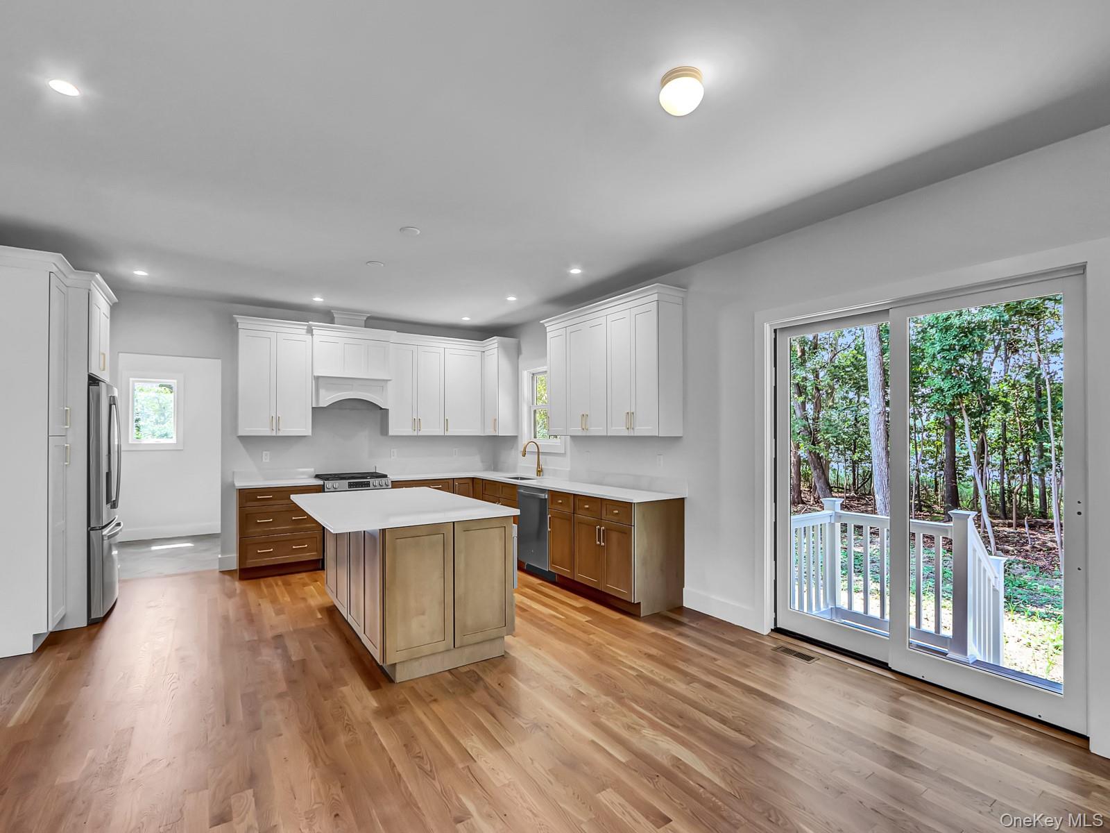 1 North Country Road Port Jefferson, NY 11777 - Photo 8 of 39 a kitchen with a stove a sink and a refrigerator