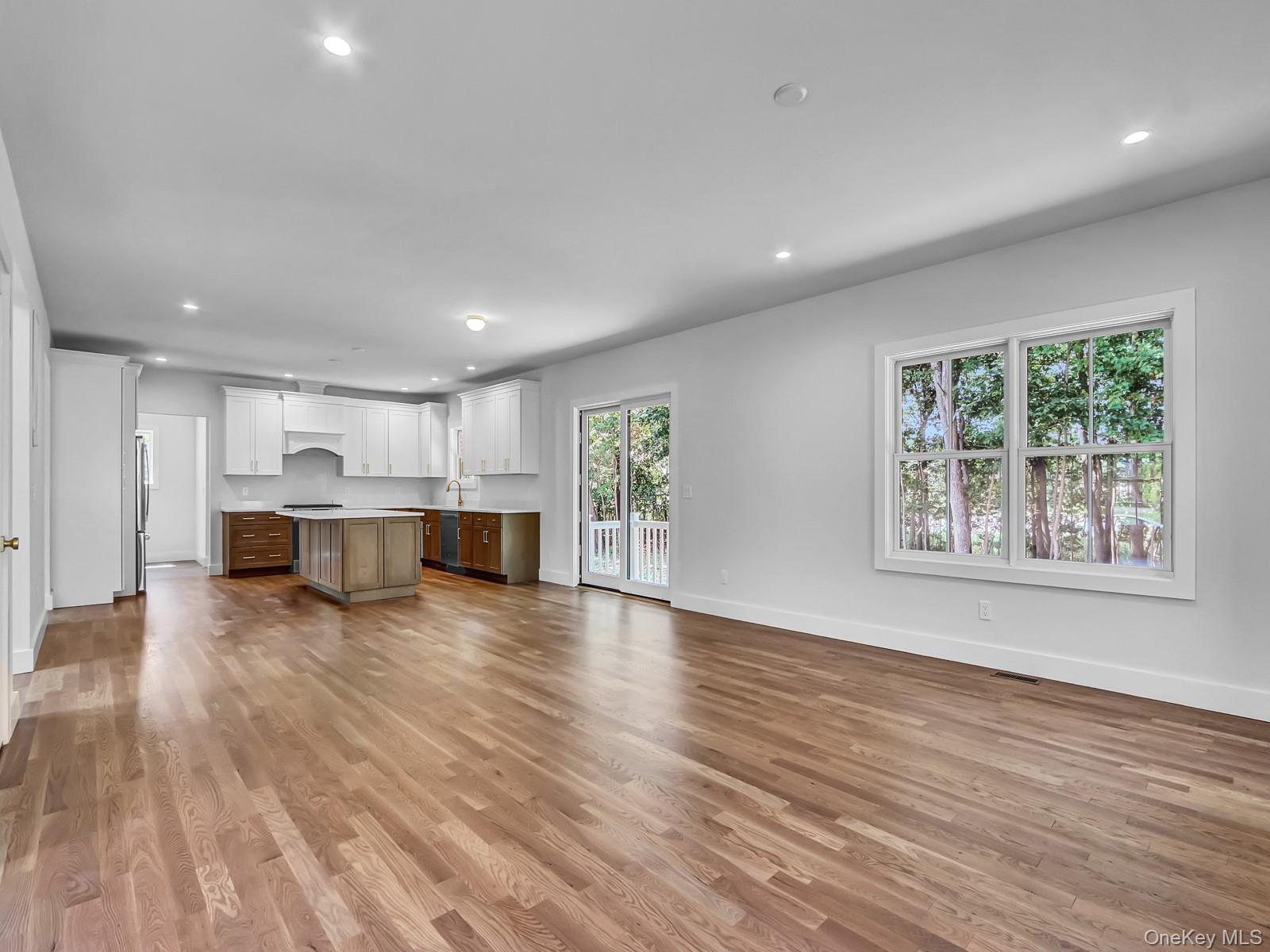 1 North Country Road Port Jefferson, NY 11777 - Photo 10 of 39 a view of an empty room with wooden floor and a window