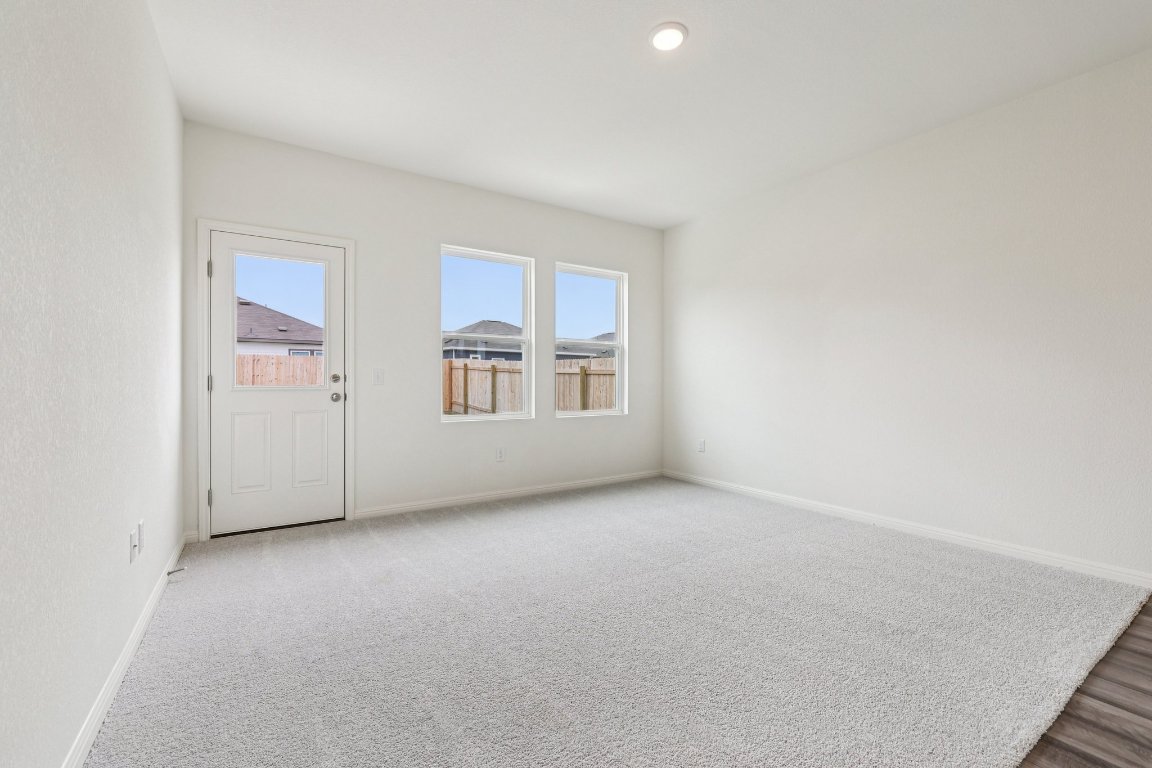 1516 Morris Loop San Marcos, TX 78666 - Photo 11 of 40 Carpeted spare room featuring baseboards